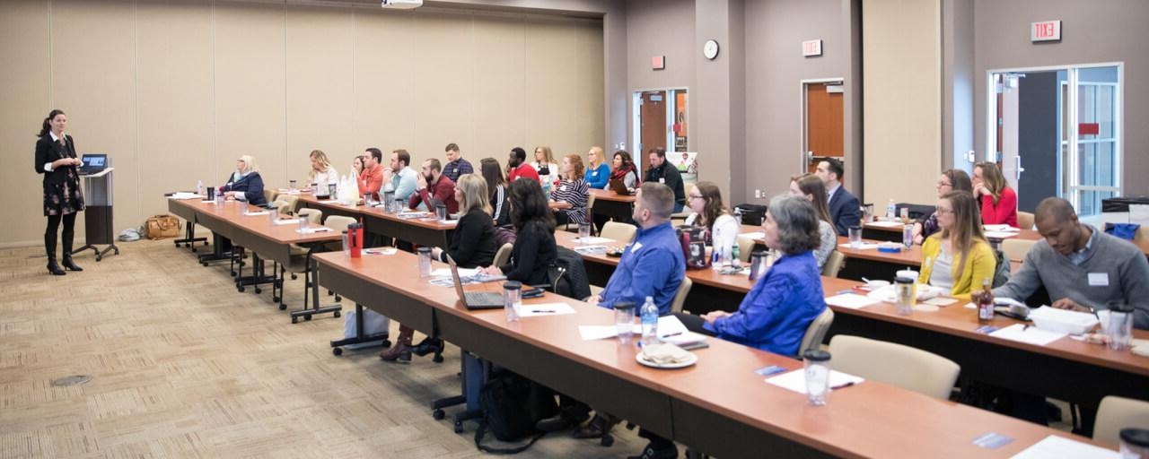 Ann Vidro presents to a group of young professionals in higher education at Davenport University